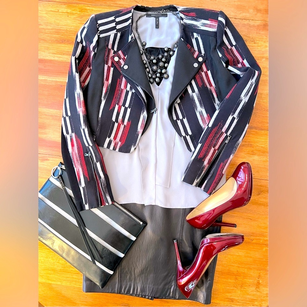 BCBG MaxAzria “Ellan” sleeveless blouse with placket top and open draped back.